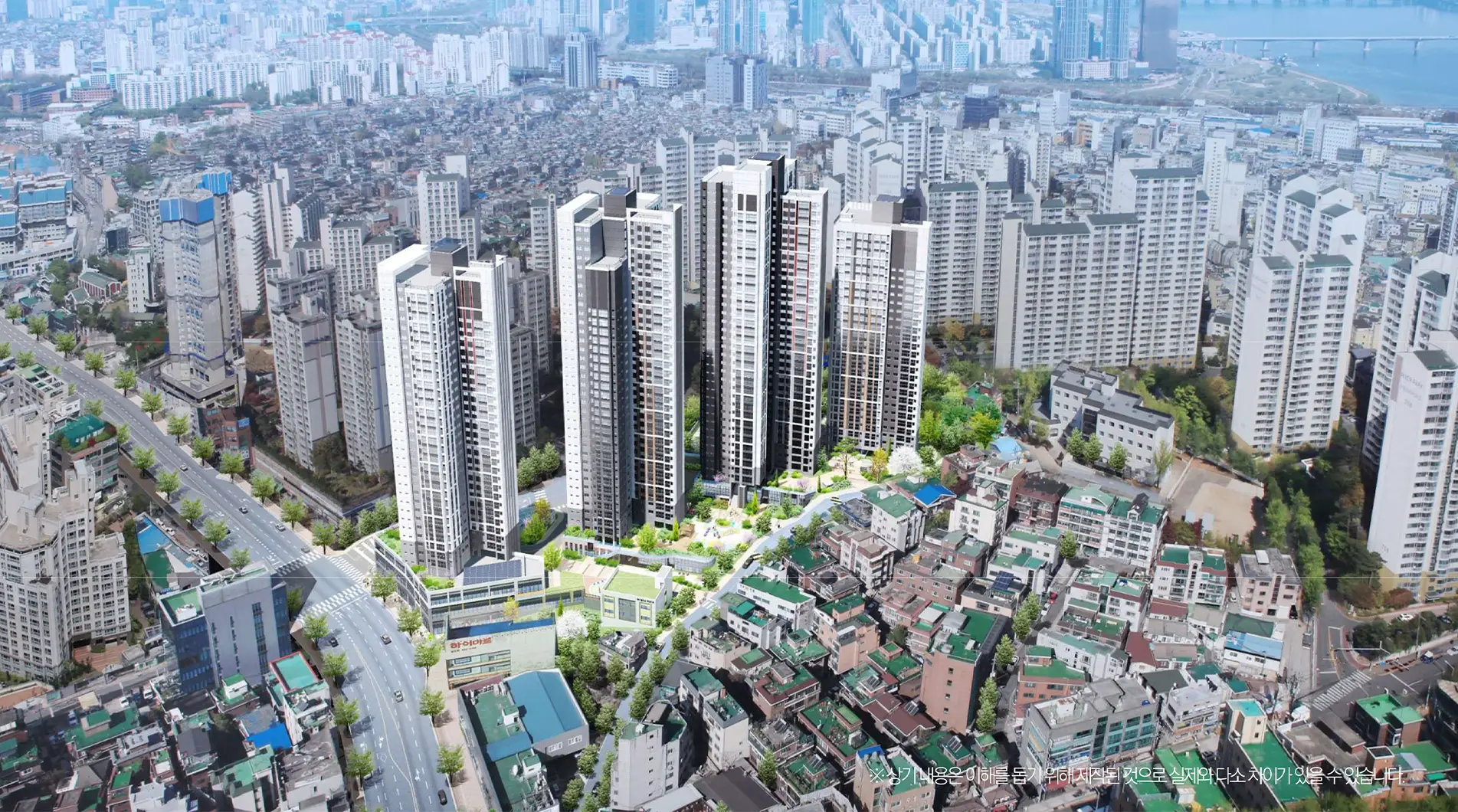 서울 도심의 고층 아파트 단지와 주변 주거 지역을 보여주는 항공 사진. 현대적인 건물과 녹지 공간이 조화롭게 어우러져 있는 모습.
